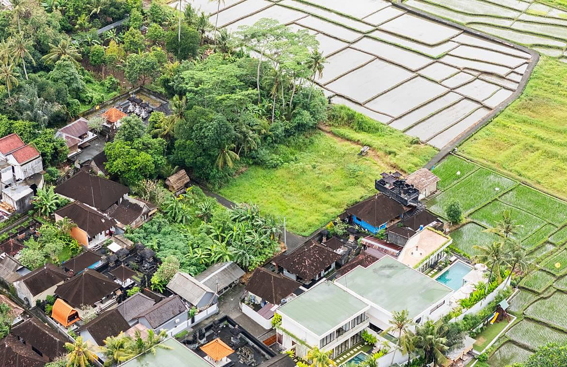 Wide oblique aerial of Cepaka village and the surrounding sawah